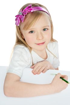 kid girl drawing with green pencils