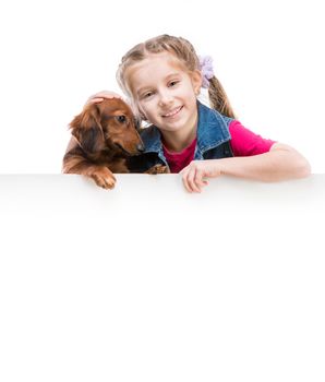 little girl and dog breed dachshund with a whiteboard for your text