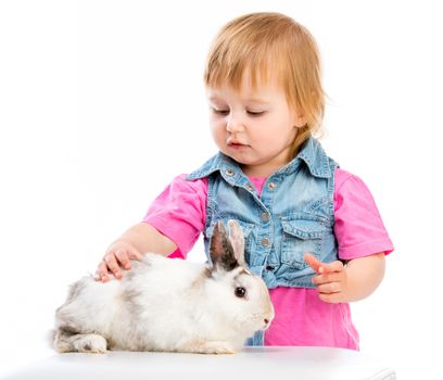 cute little baby petting Easter bunny on a white background