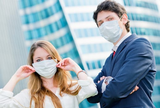 Junior executives dynamics  wearing protective face mask against pollution
