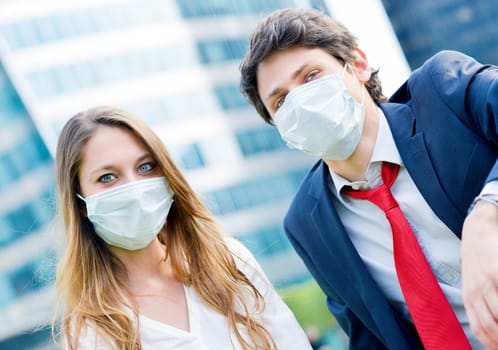 Junior executives dynamics  wearing protective face mask against pollution