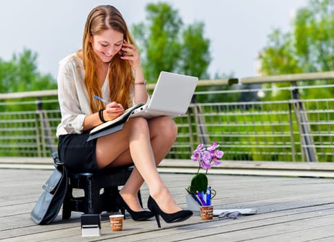 Junior executive dynamic working outside of her office