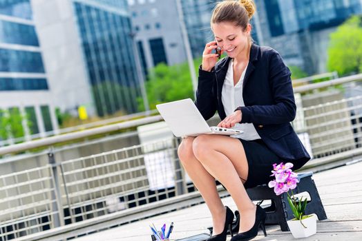 Junior executive dynamic working outside of her office