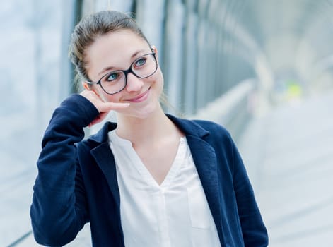 Dynamic young executive gesturing to call