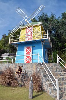 Wooden windmill house, sunny day