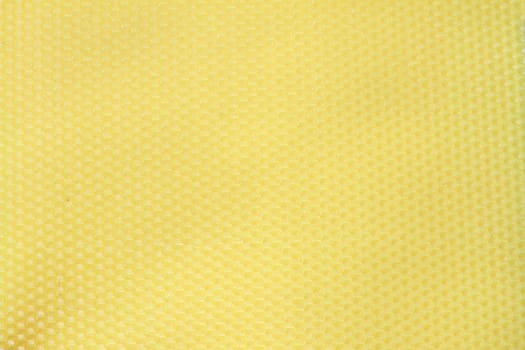 bee wax yellow texture, interesting detail of hexagonal pattern