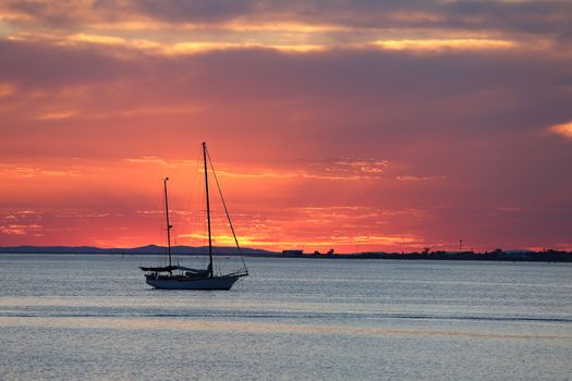 Sailing boat on the sea in twilight