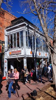 BOULDER, COLORADO, JANUARY 27, 2014: Visitors visit the downtown areas of Boulder, Colorado. Boulder Downtown area, including the Pearl Street Mall, is in the western part of present-day Boulder.