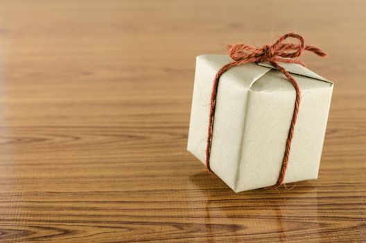 brown gift box on wooden background