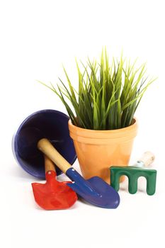 gardening tools and grass on white background 