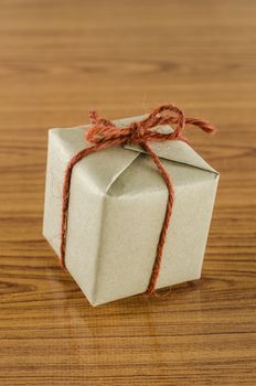 brown gift box on wooden background