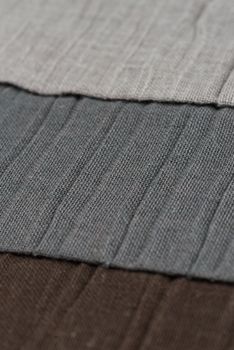 Closeup detail of grey fabric texture background.