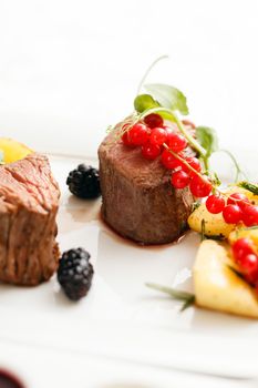 steak with fresh berries