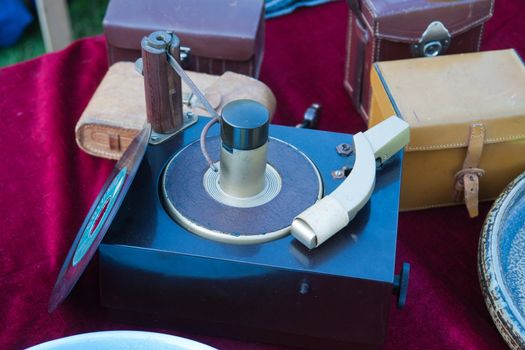 An old vintage record player for sale in a flea market