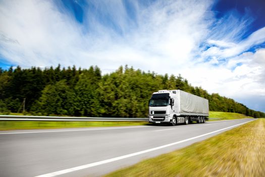 Truck delivery cargo on the highway in motion