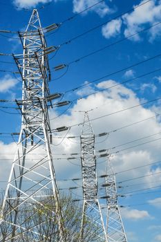 High voltage electrical power lines on sky background