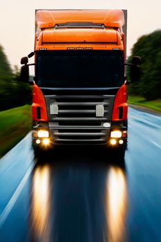 Truck delivery cargo on the highway in motion