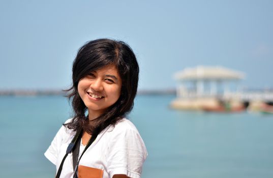 young beautiful asian girl on the seaside 