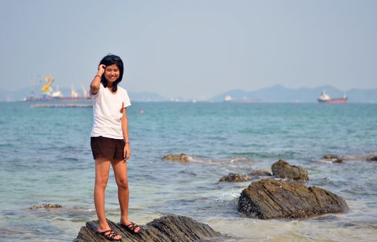 Beautiful young asian woman on beach summer holiday