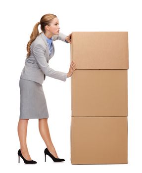 business, post and transportation concept - busy businesswoman pushing tower of cardboards