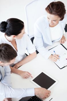 business concept - friendly business team having discussion in office