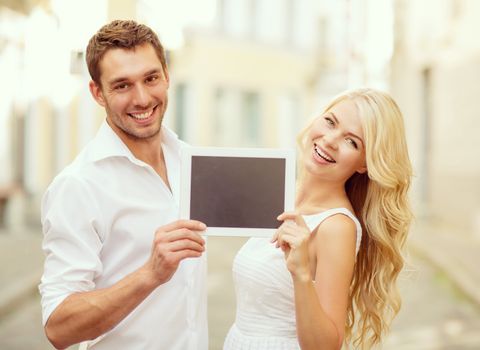 summer holidays, wedding, dating and technology concept - couple with tablet pc in the city