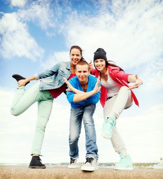 sport, dancing and urban culture concept - group of teenagers dancing