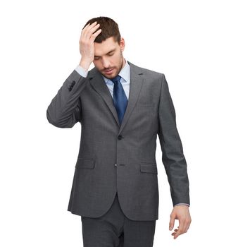business, education and office concept - handsome businessman having headache