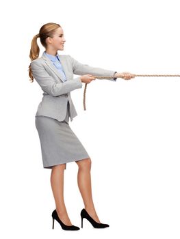 business and education concept - smiling businesswoman pulling rope