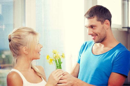 bright picture of happy romantic couple with flowers