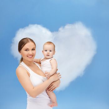 family, child and happiness concept - happy mother with adorable baby