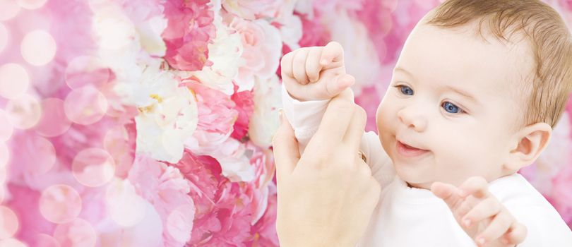 child, happiness and people concept - adorable baby boy