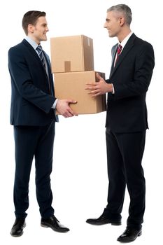 Young businessmen holding cardboard boxes