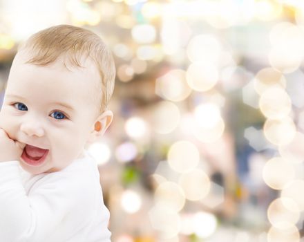 child, people and happiness concept - adorable baby boy