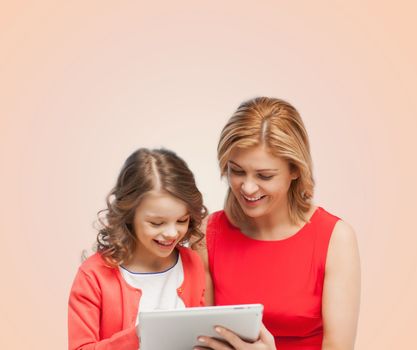 family, child and technology concept - smiling mother and daughter with tablet pc computer