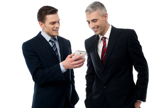 Handsome businessmen looking at smart phone