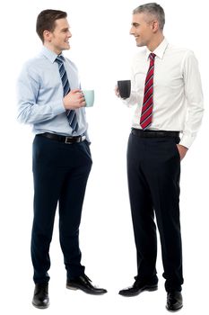 Young men discussing business over a cup of coffee