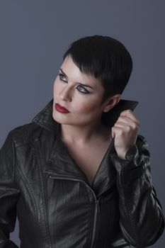 sexy brunette woman in black leather jacket, biker