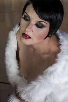 Sexy brunette woman dressed in 20s style