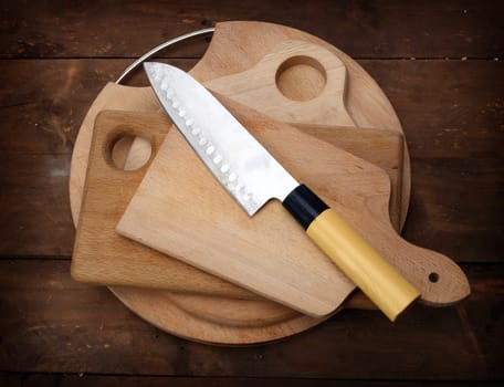 kitchen knife on stack of kitchen planks