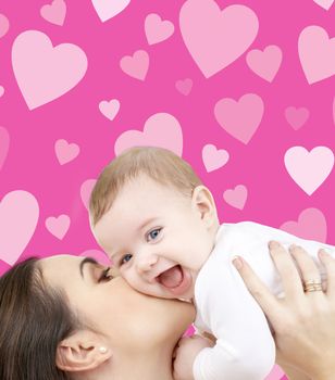 family, child and happiness concept - happy mother with baby