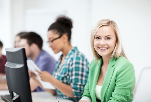 education concept - student girl with computer studying at school