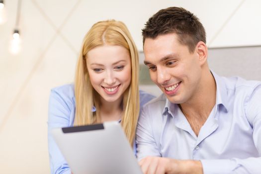 business, hotel, trave and technology concept - smiling couple with tablet pc computer in hotel room