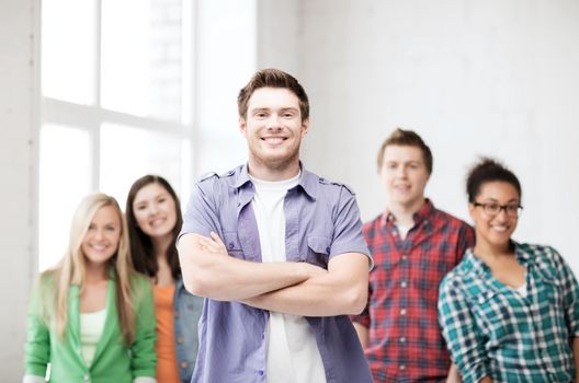 education concept - student boy with group of students at school