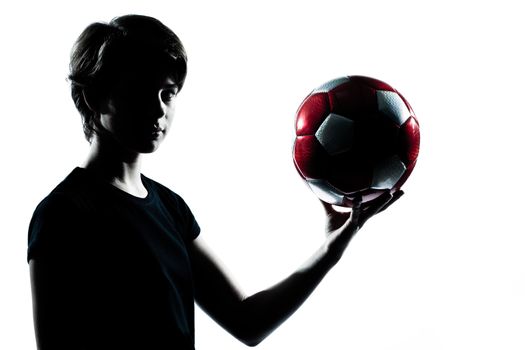one  young teenager silhouette boy girl holding showing soccer football portrait in studio cut out isolated on white background