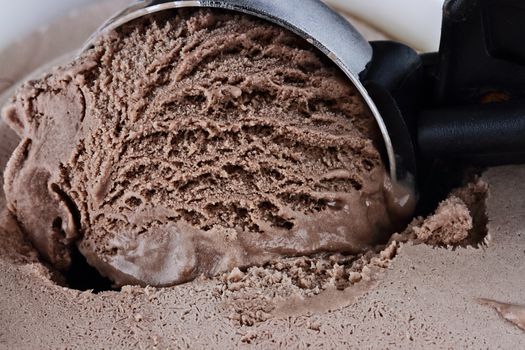 Scoop of rich chocolate ice cream with extreme shallow depth of field.