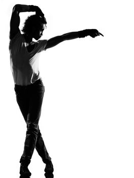 full length silhouette of a young man dancer dancing funky hip hop r&b on isolated studio white background