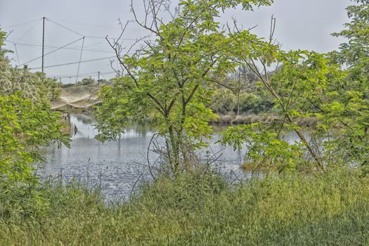 Fishing huts on the Pialassa della Baiona brackish lagoon near Marina Romea along the  Adriatic seaside in Ravenna (Italy)