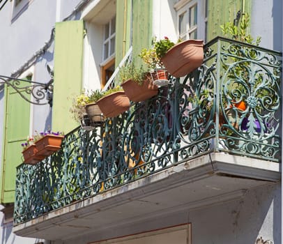 Balcony with hanging flower pot in France