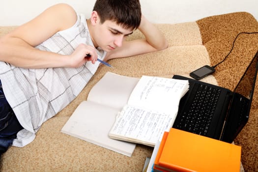 Teenager preparing for Exam at the Home